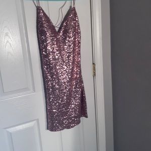 Tight fitted dress with sparkle to it pinkish only worn 3 times .
